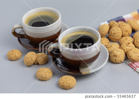 Cookie and two cups of coffee. Kruidnoten, pepernoten, strooigoed 55465637