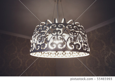 Close-up of a beautiful crystal chandelier Beautiful chandelier. luxury expensive chandelier hanging Close-up of a beautiful crystal chandelier Beautiful chandelier. luxury expensive chandelier hanging 55465993