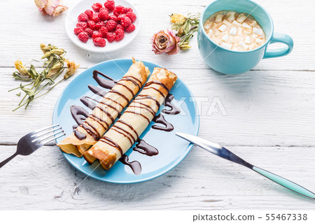 Pancakes topped on wooden table, 55467338