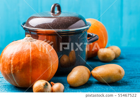 Picture of pot with lid, vegetables, potatoes, pumpkin, onions 55467522