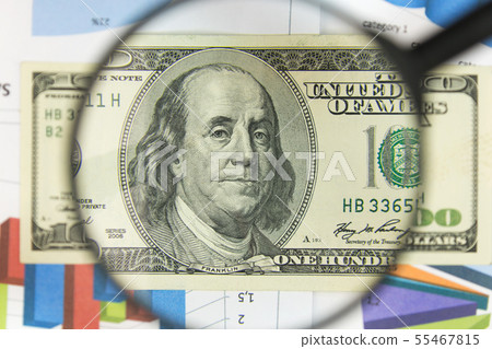 Close-up of hundred dollars through a magnifying Close-up of hundred dollars through a magnifying 55467815