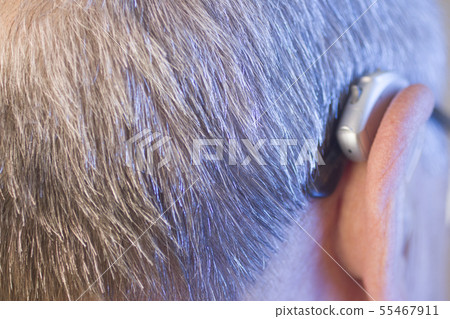 Man with hearing aid Man with hearing aid 55467911