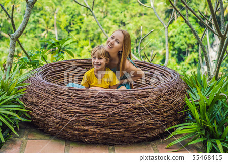 Bali trend, straw nests everywhere. Happy family enjoying their travel around Bali island, Indonesia Bali trend, straw nests everywhere. Happy family enjoying their travel around Bali island, Indonesia 55468415