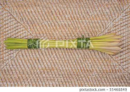 Eco-friendly product packaging concept. Lemongrass wrapped in a banana leaf, as an alternative to a Eco-friendly product packaging concept. Lemongrass wrapped in a banana leaf, as an alternative to a 55468849