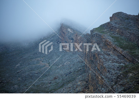 Photo of picturesque mountain terrain, foggy sky Photo of picturesque mountain terrain, foggy sky 55469039