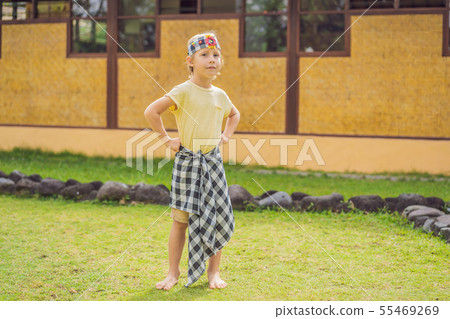 Boy tourist in sarong, national Balinese clothing Boy tourist in sarong, national Balinese clothing 55469269