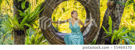 BANNER, LONG FORMAT Bali trend, straw nests everywhere. Young tourist enjoying her travel around 55469370