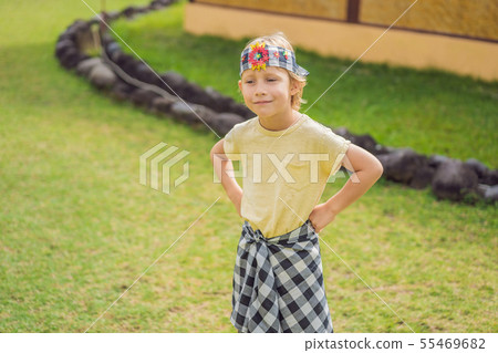 Boy tourist in sarong, national Balinese clothing Boy tourist in sarong, national Balinese clothing 55469682