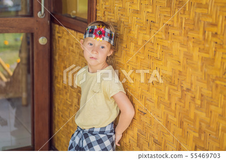 Boy tourist in sarong, national Balinese clothing Boy tourist in sarong, national Balinese clothing 55469703