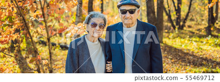 Pensioners in sunglasses in the autumn forest. Pensioners like gangsters BANNER, LONG FORMAT Pensioners in sunglasses in the autumn forest. Pensioners like gangsters BANNER, LONG FORMAT 55469712