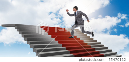 Young businessman climbing stairs and red carpet into sky Young businessman climbing stairs and red carpet into sky 55470112