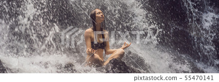 Wellness spa, vacation and yoga meditation concept. Young woman sitting in lotus position on the Wellness spa, vacation and yoga meditation concept. Young woman sitting in lotus position on the 55470141