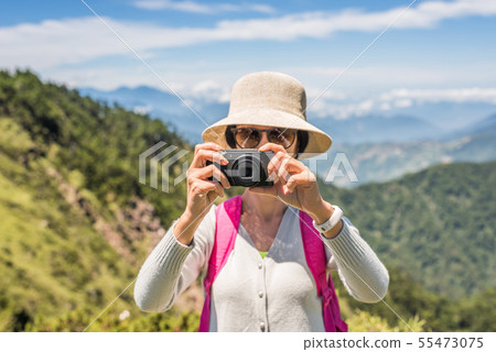 Asian climbing woman take pictures Asian climbing woman take pictures 55473075