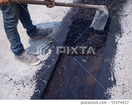 Worker use vibratory plate compactor compacting 55474017