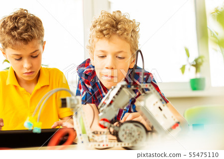 Nice intelligent boys having a science class 55475110