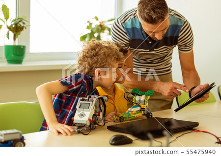 Nice smart man holding a tablet in his hands 55475940