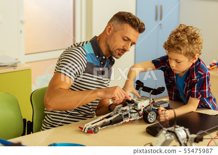 Nice bearded man sitting with his son Nice bearded man sitting with his son 55475987