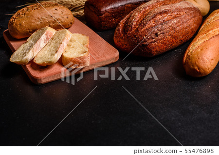 Fresh fragrant bread with grains and cones  55476898