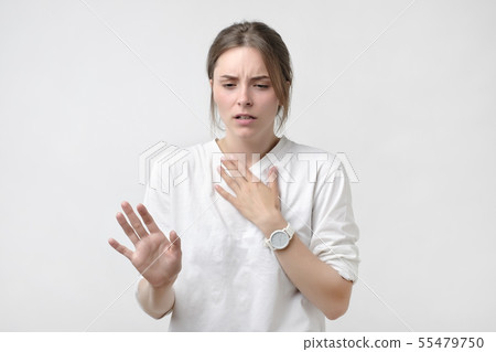 European woman in white t-shirt having a sore 55479750
