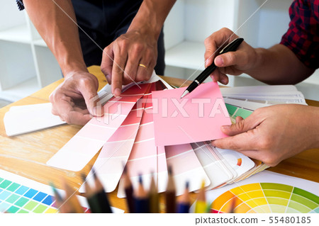 Graphic designer choose pink tone from color bands 55480185