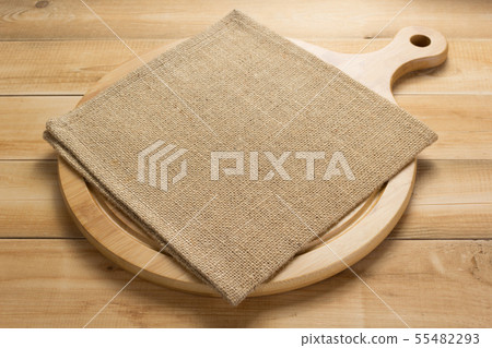 pizza cutting board and napkin at rustic wooden 55482293