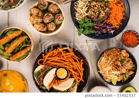 Asian food background with various ingredients on rustic wooden table. 55482337