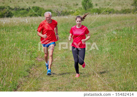 Senior man and his grandchild running Senior man and his grandchild running 55482414
