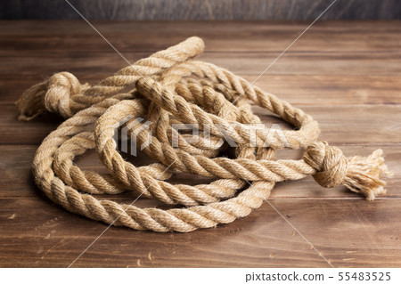 ship rope at wooden board background ship rope at wooden board background 55483525