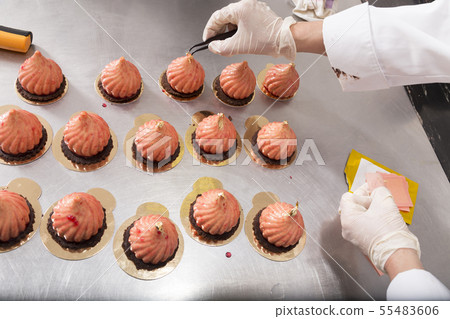 Making mousse cake in the shape of a dome. Making mousse cake in the shape of a dome. 55483606