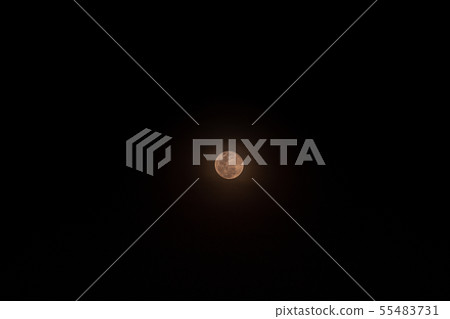 The Small full moon isolated over black background 55483731