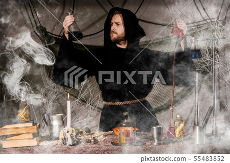 The medieval alchemist make magic ritual at the The medieval alchemist make magic ritual at the 55483852
