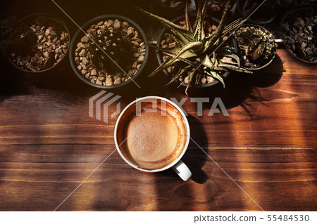 Hot Coffee Latte Cup on Wooden Table under with Hot Coffee Latte Cup on Wooden Table under with 55484530