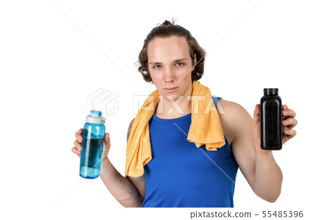 Handsome young man in sport shirt holding bottle 55485396