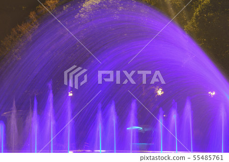 Fountain spray in blue neon illumination 55485761