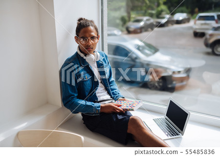 Angry young freelancer looking straight at camera 55485836