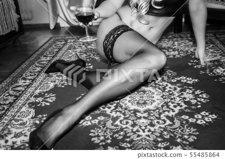 sexy blond girl sitting on the carpet 55485864