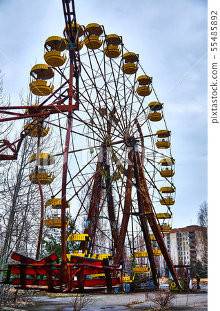 Old ferris wheel in the ghost town of Pripyat. Consequences of the accident at the Chernobil nuclear Old ferris wheel in the ghost town of Pripyat. Consequences of the accident at the Chernobil nuclear 55485892