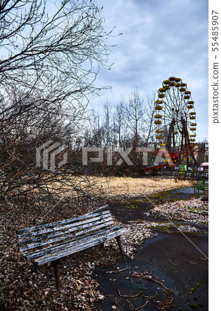 Old ferris wheel in the ghost town of Pripyat. Consequences of the accident at the Chernobil nuclear Old ferris wheel in the ghost town of Pripyat. Consequences of the accident at the Chernobil nuclear 55485907