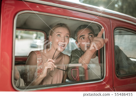 Married couple seeing the sights from the car. 55486455