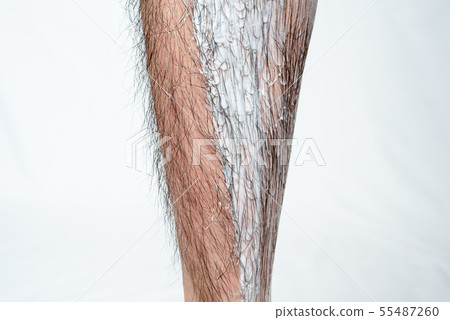 Image which applied hair removal cream to a part of men's leg hair removal Image which applied hair removal cream to a part of men's leg hair removal 55487260