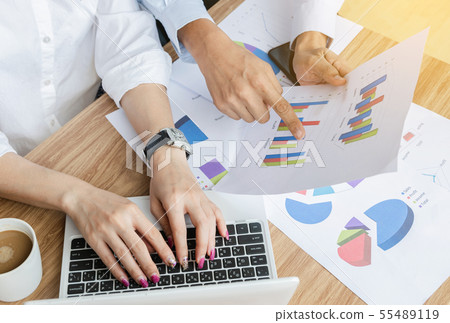 Business team work analyzing charts and graphs Business team work analyzing charts and graphs 55489119