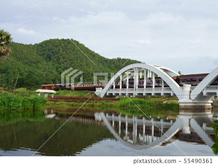 Diesel Train passing the Tha Chom Phu railway 55490361
