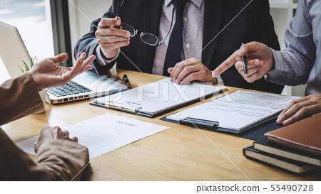 Business woman explaining about his profile to two Business woman explaining about his profile to two 55490728