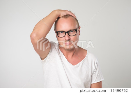 Male blogger wears spectacles and white t-shirt 55490762