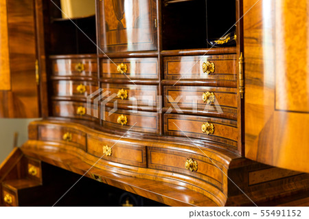 Ancient wooden dresser with many drawers in museum Ancient wooden dresser with many drawers in museum 55491152