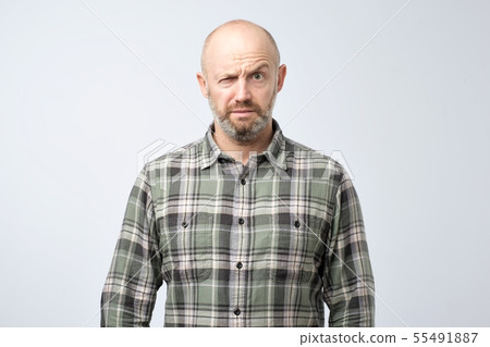 Closeup portrait of angry mature man Closeup portrait of angry mature man 55491887
