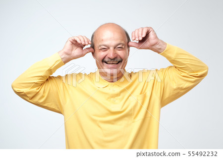 Mature adult man with moustache laughing   55492232