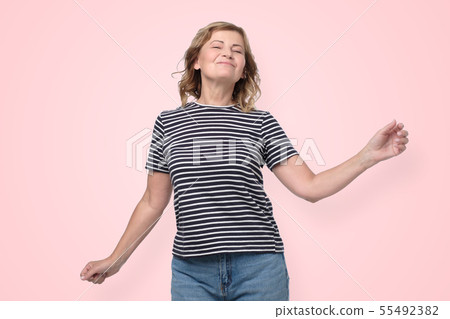 Lovely mature woman in casual clothes posing   55492382