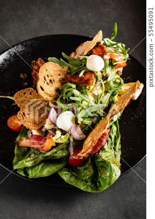 creative caesar salad on the black plate creative caesar salad on the black plate 55495091