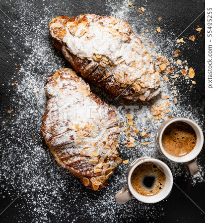 Croissants with almonds on the black background 55495255